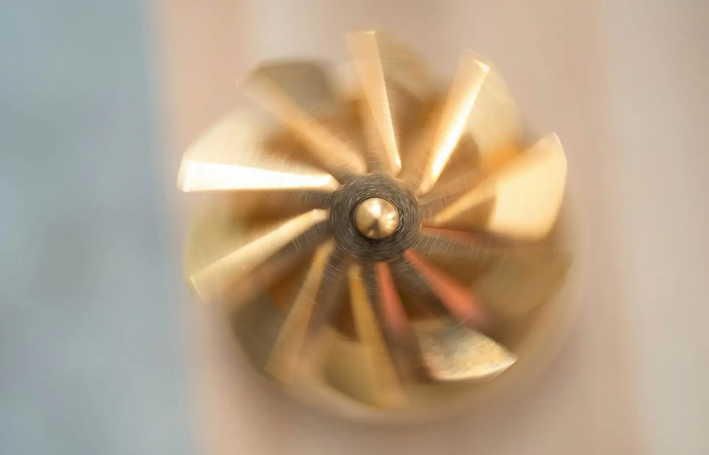 Centrifugal pump impeller with curved vanes and wetted surfaces highlighted for material selection