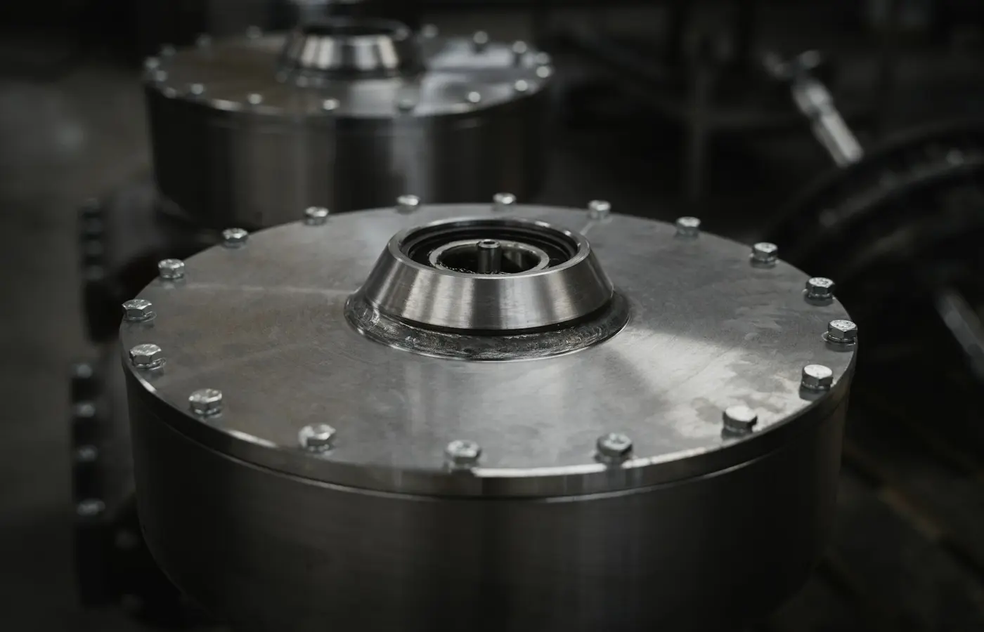 Close-up of a metal object in a factory, illustrating industrial coupling hardware.
