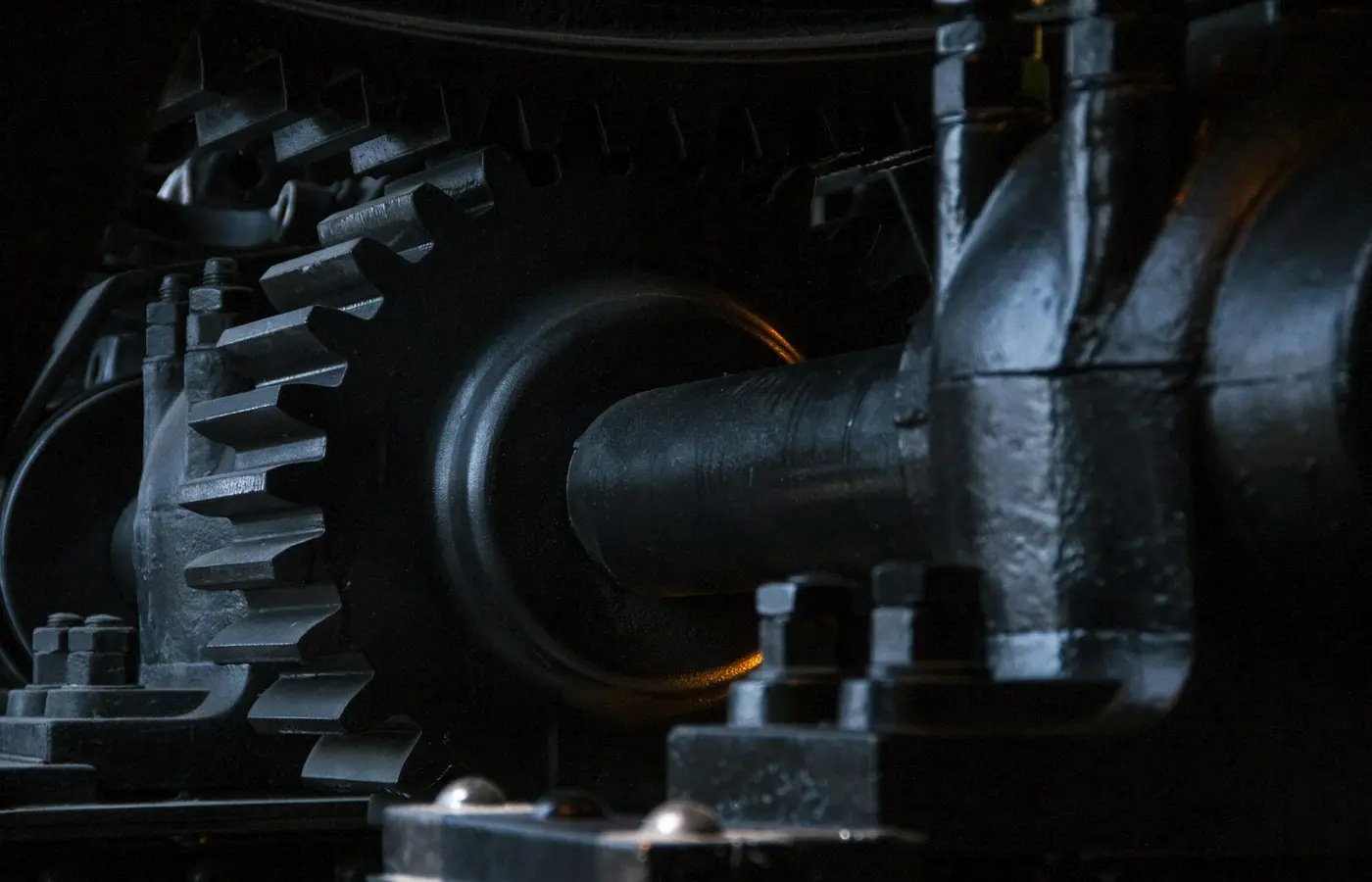 Industrial helical gearbox assembly with visible gears and housing components