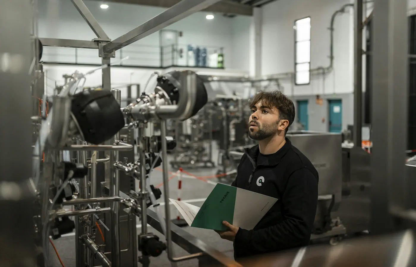 Illustration of industrial equipment test evidence being reviewed before shipment